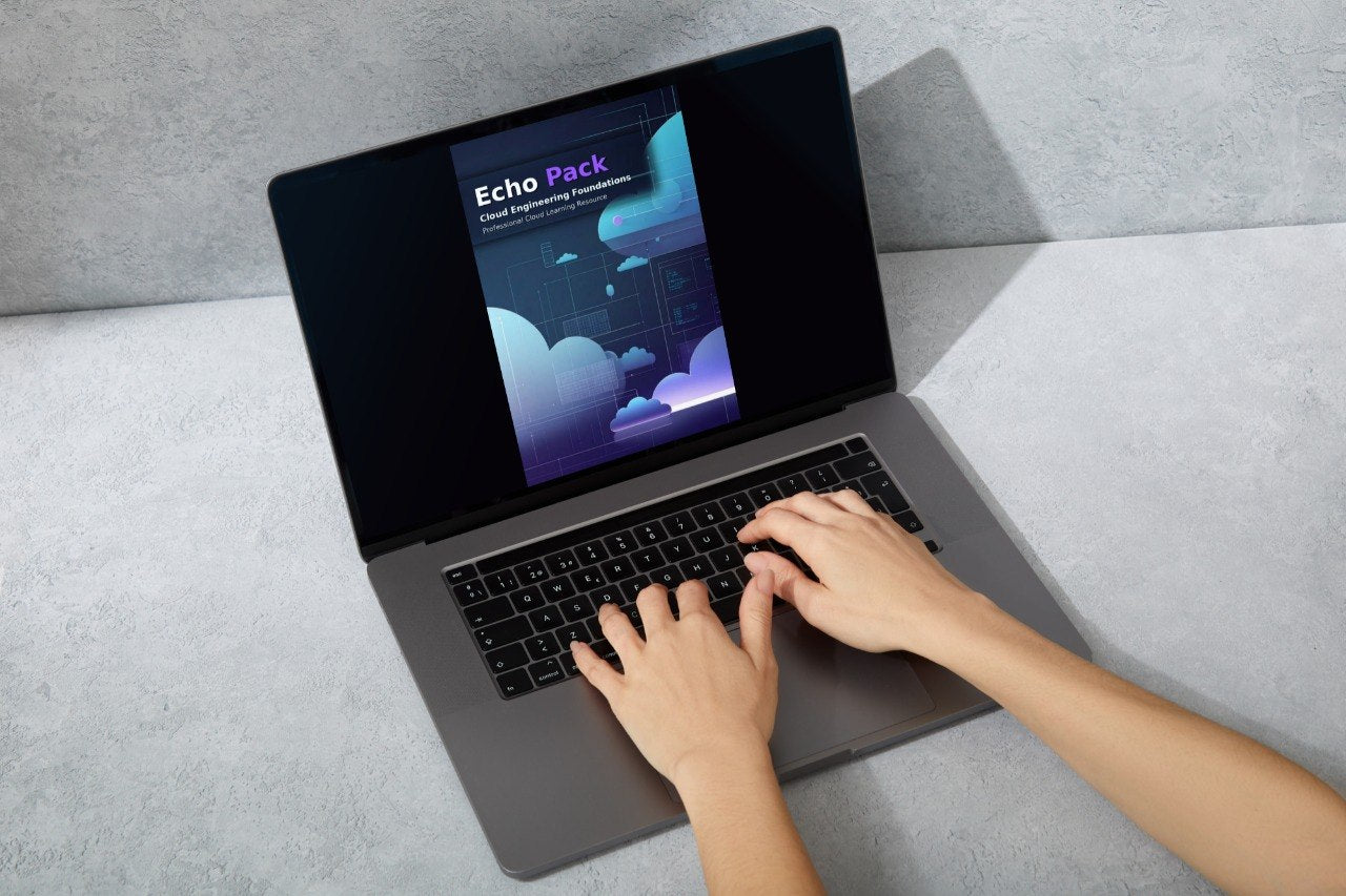 A person's hands typing on a dark gray laptop with the screen turned on, displaying a digital graphic template pack titled 'Echo Pack'. The laptop is placed on a light gray textured surface against a matching gray background.